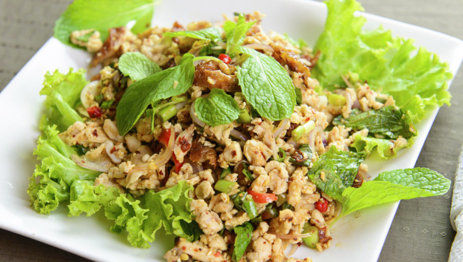 Thai style chicken salad served on white plate